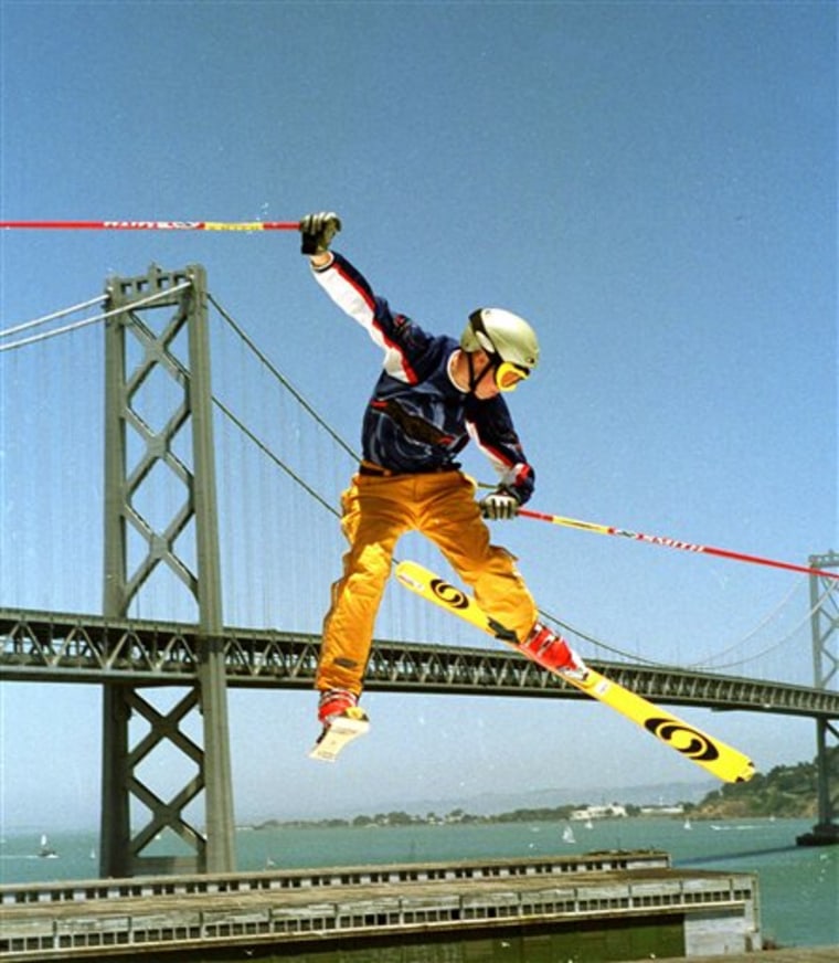 C.R. Johnson flies through the air during a practice jump at the ESPN X games at Pier 30-32 in San Francisco. The skiier was killed when he fell face first, spun around and struck the back of his head on rocks on Wednesday. He was wearing a helmet at the time. 